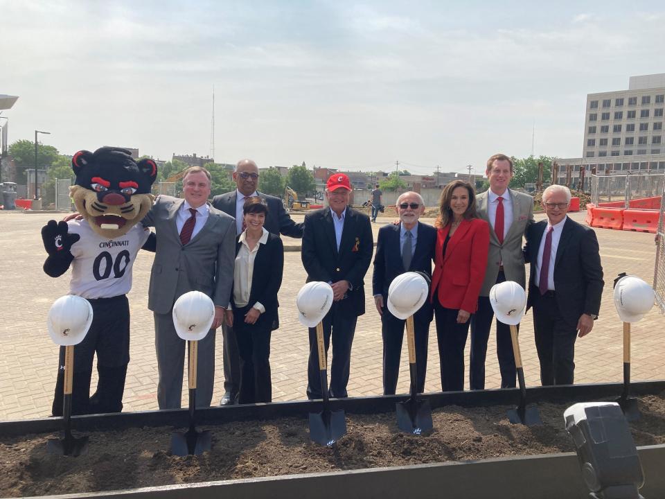 University of Cincinnati officials broke ground on their new indoor practice facility in May. From left are the Bearcat, board member Phil Collins, board member Kim Heiman, President Neville Pinto, board members/facility donor Larry Sheakley, board member Steve Boymel, facility donor Rhonda Sheakley, athletic director John Cunningham and UC Foundation President Peter Landgren.