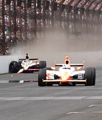 Dan Wheldon takes the lead to win the Indianapolis 500 as JR Hildebrand skids along the wall