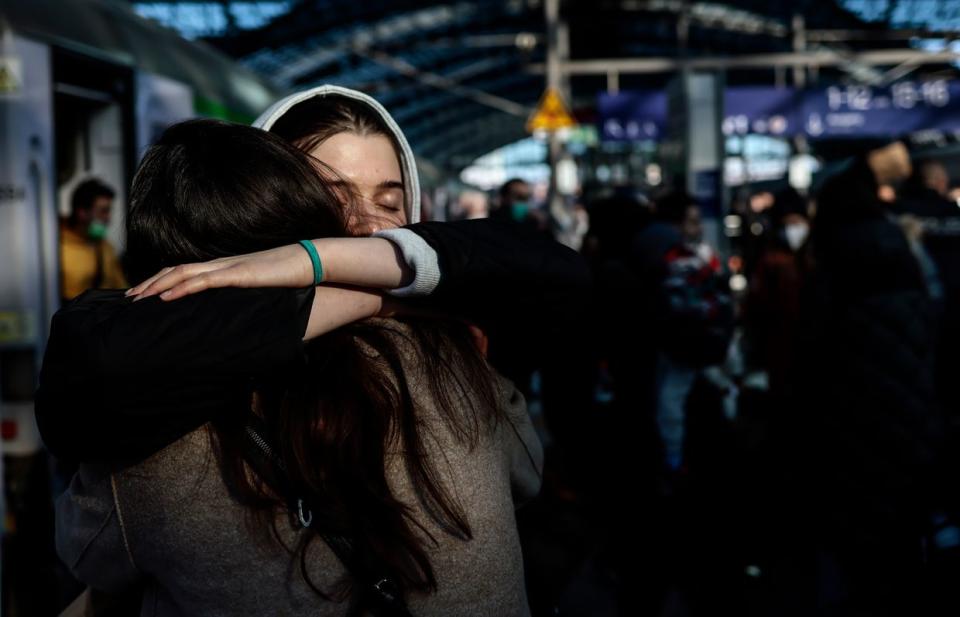 Two women hug each other deeply after refugees from Ukraine arrive at the main train station on March 1, 2022 in Berlin, Germany. (Hannibal Hanschke/Getty Images)