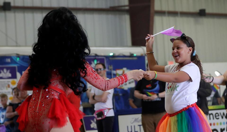 Ms. Deville interacts with fan Raena Fellers of Green Bay during the 14th annual N.E.W. Pride on Sept. 23, 2023, in De Pere, Wis. The event featured drag shows, live music, food trucks, vendors and displays highlighting the history of northeastern Wisconsin's LGBTQ+ community.