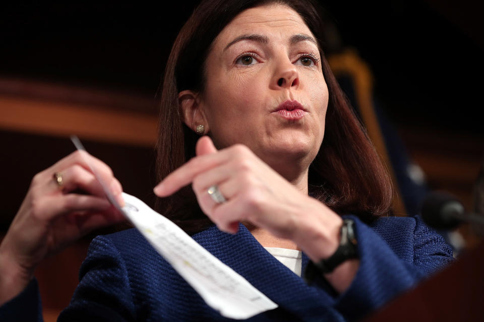 Sen. Kelly Ayotte (R-N.H.) points to a flow chart of the State Department organizational structure during a press conference discussing the Accountability Review Board report into the Benghazi terrorist attack at the U.S. Capitol December 21, 2012 in Washington, D.C. (Photo by Win McNamee/Getty Images)