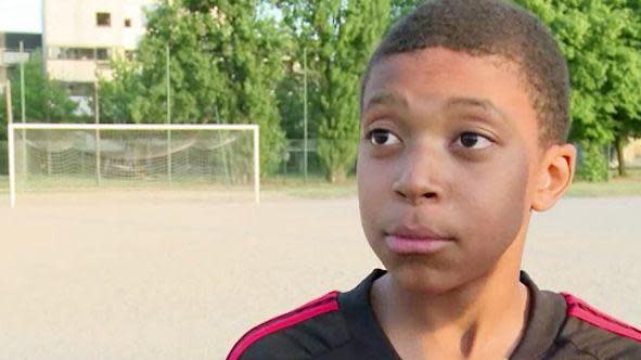 Mbappe as a child on training pitch.