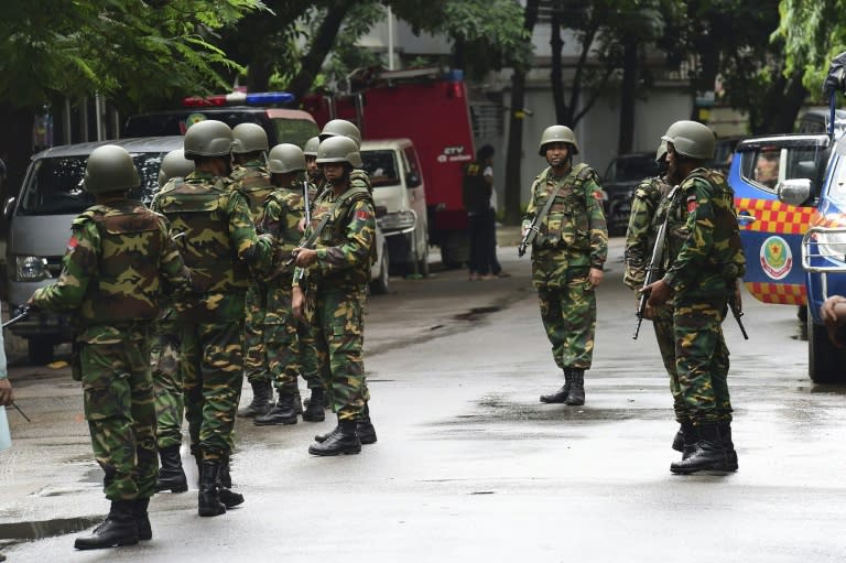 Bangladeshi soldiers stand guard during a rescue operation as gunmen take position in a restaurant in the Dhaka’s high-security diplomatic district on July 2, 2016