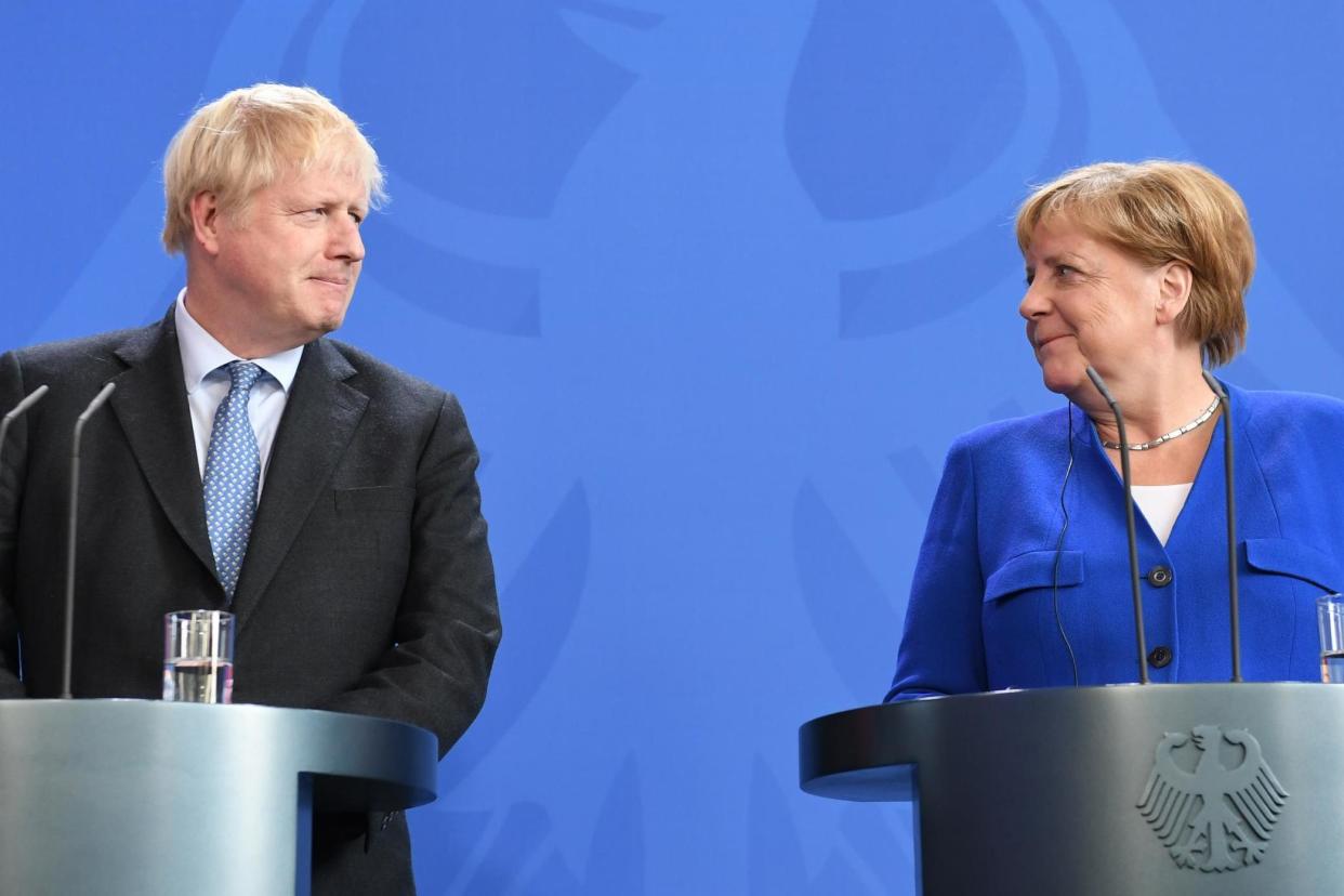Boris Johnson pictured with Angela Merkel in August: Stefan Rousseau/PA