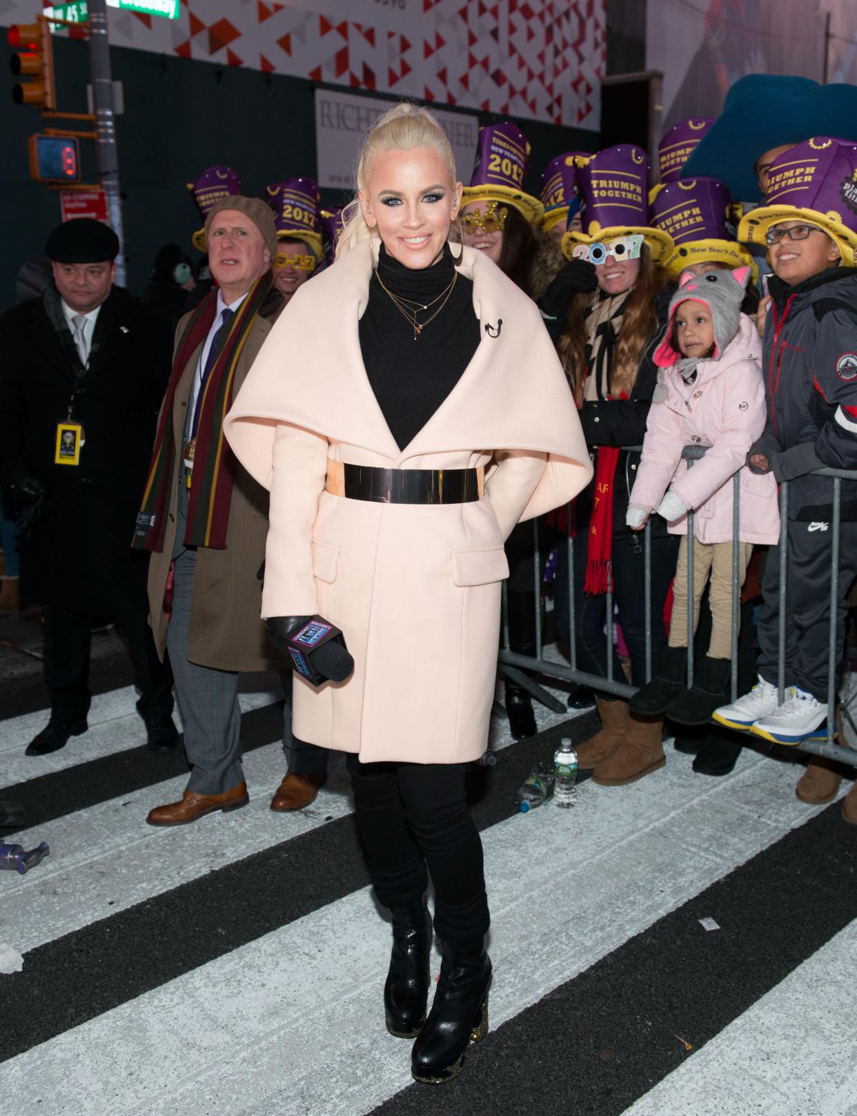 Jenny McCarthy poses on New Year's Eve holding a m