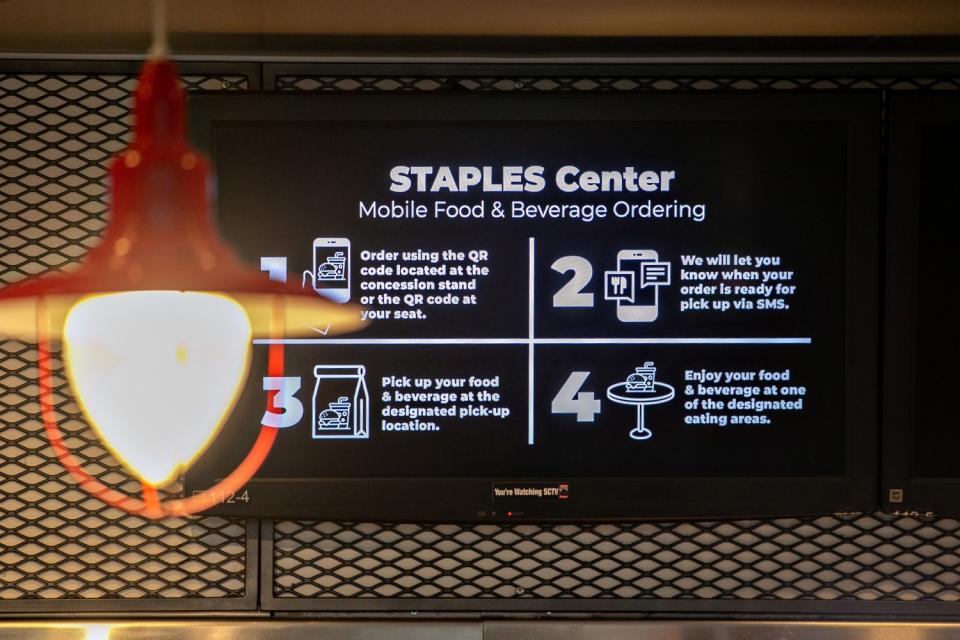 A sign explains the new mobile ordering system for food and beverages