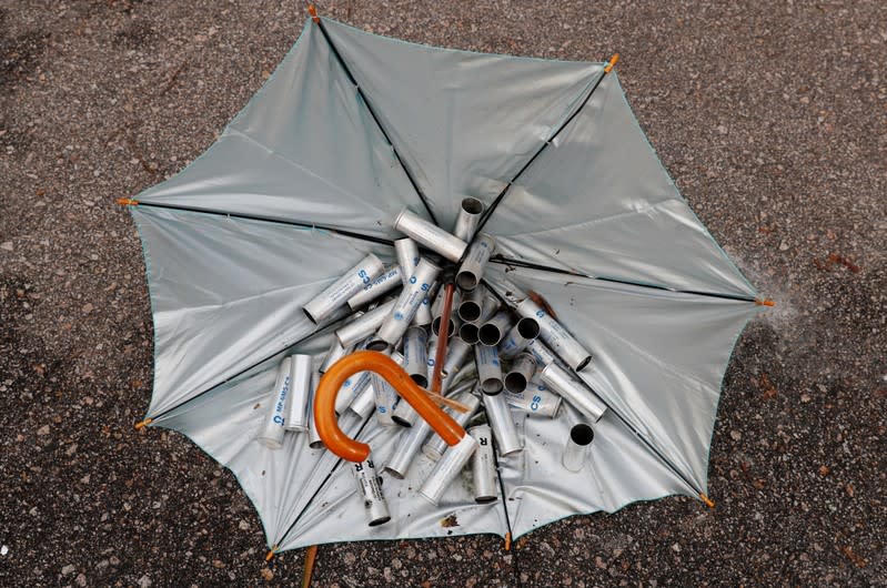 Tear gas shells lie in an umbrella as university students standoff with riot police at the Chinese University of Hong Kong, Hong Kong