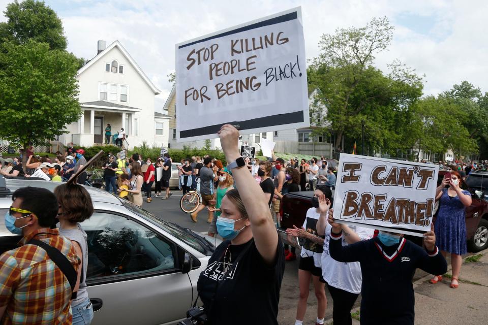 Hundreds of protesters gather near the site of the arrest of George Floyd, who died in police custody Monday night.