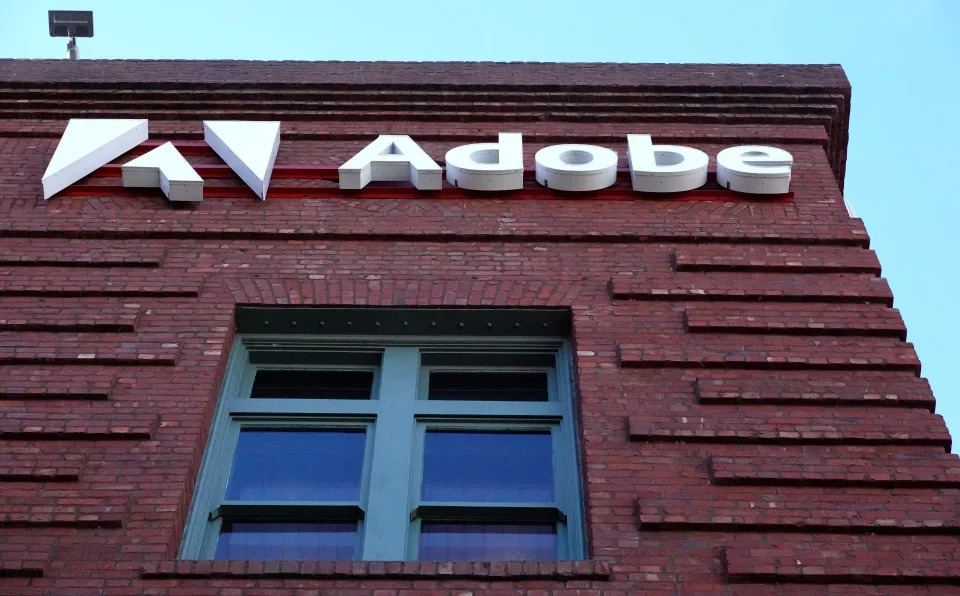 SAN FRANCISCO, CALIFORNIA - DECEMBER 13: A sign is displayed on the exterior of an Adobe office on December 13, 2023 in San Francisco, California. Computer software company Adobe will report fourth quarter earnings today after the closing bell. (Photo by Justin Sullivan/Getty Images)