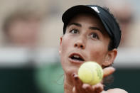 Spain's Garbine Muguruza serves against Estonia's Kaia Kanepi during their first round match at the French Open tennis tournament in Roland Garros stadium in Paris, France, Sunday, May 22, 2022. (AP Photo/Thibault Camus)