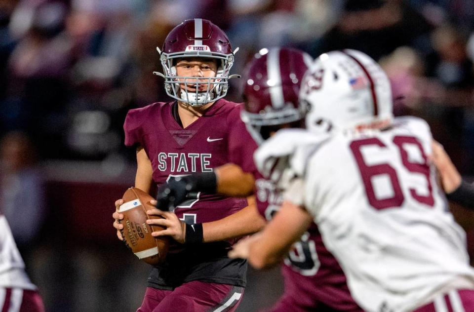 State College’s Eddie Corkery drops back to make a pass during the game against Altoona on Friday, Sept. 15, 2023.