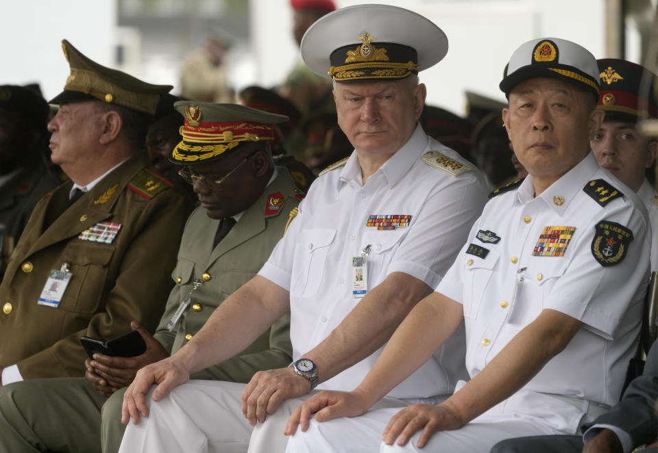 Admiral Nikolai Yevmenov, Commander-in-Chief of the Russian Navy, second right, and Chinese naval officers attend the Armed Forces Day in Richards Bay, South Africa, Feb. 21, 2023, amid joint naval exercises off the east coast of the country with Russian and Chinese navies. / Credit: Themba Hadebe/AP