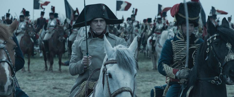 Napoleon Bonaparte (Joaquin Phoenix, center) prepares for battle in Ridley Scott's historical war epic "Napoleon."
