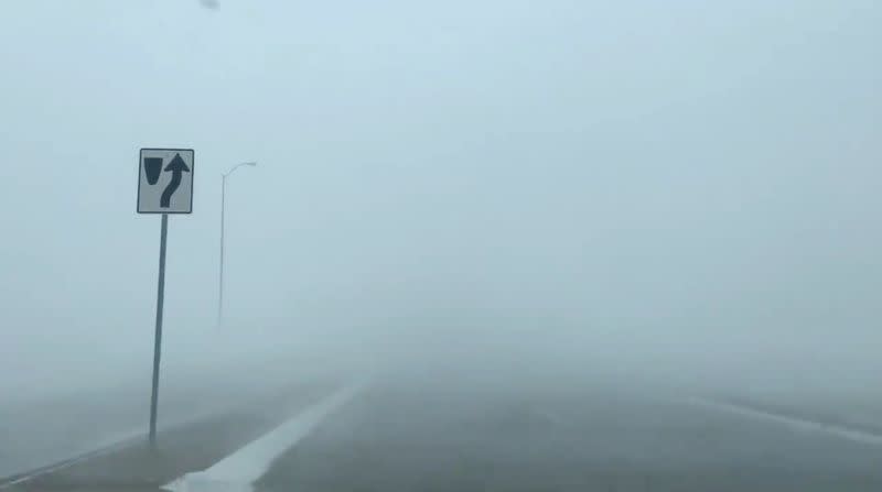 A blizzard seen along a road in Sioux Falls, South Dakota, U.S. in this still frame obtained from social media video dated December 23, 2020