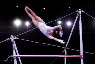 <p>Suni is a true star on the uneven bars. Her uneven bars routine is considered one of the most difficult in the world. (Photo by Laurence Griffiths/Getty Images)</p> 