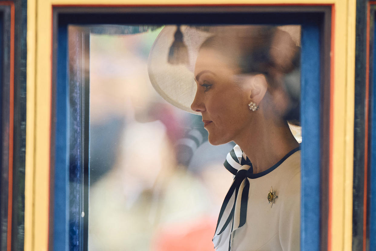 TOPSHOT - Britain's Catherine, Princess of Wales, rides the Glass State Coach at Horse Guards Parade during the King's Birthday Parade 