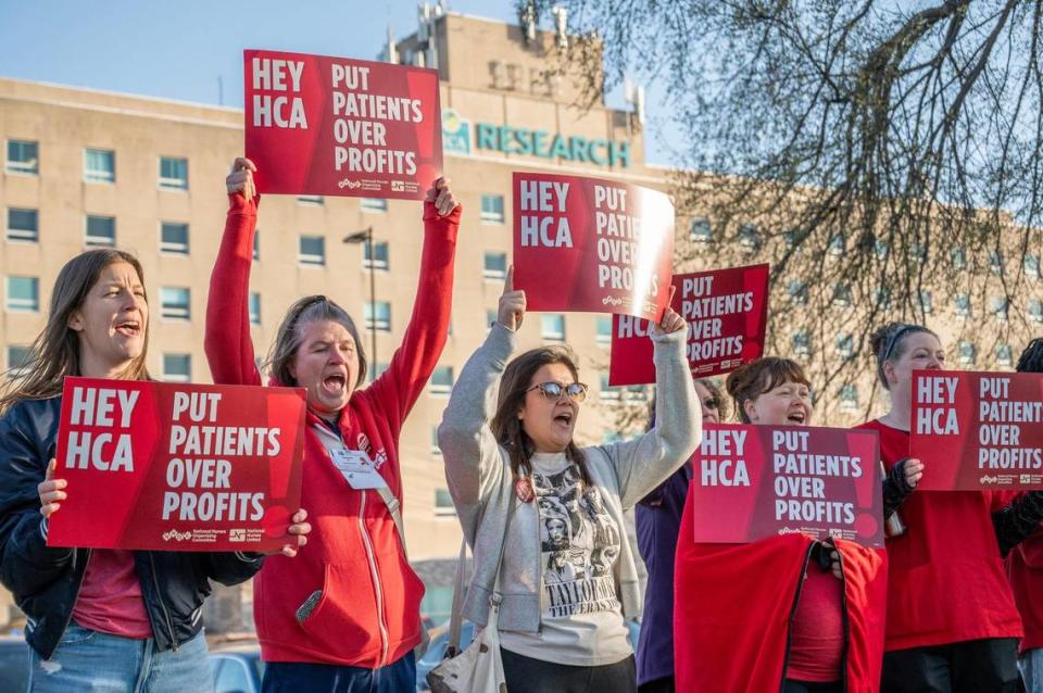 Demonstrators rally outside of the Research Medical Center building to support ongoing negotiations with HCA regarding contract renegotiations on Tuesday, March 12, 2024, in Kansas City.