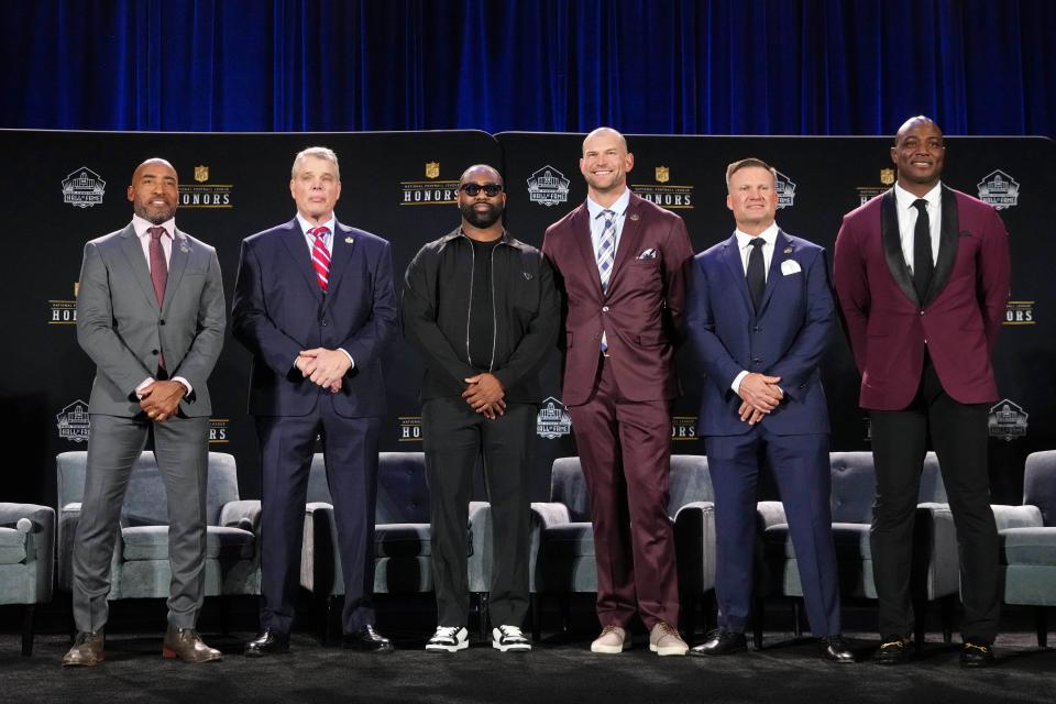 Six members of the Pro football Hall of Fame's Class of 2023 — (from left) Ronde Barber, Joe Klecko, Darielle Revis, Joe Thomas, Zach Thomas, DaMarcus Ware — pose for a photo at Symphony Hall, Feb. 9, 2023, in Phoenix.