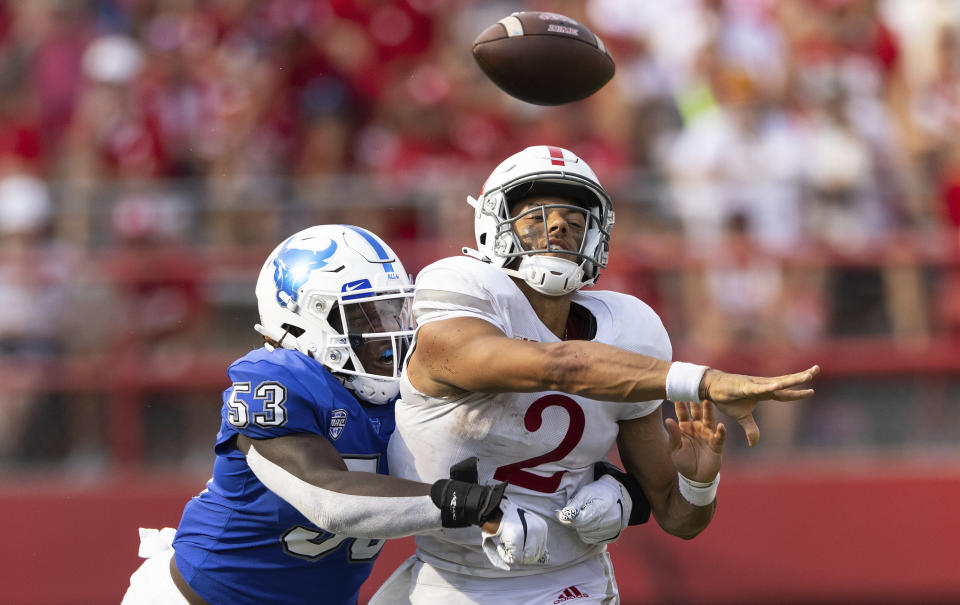 FILE - In this Saturday, Sept. 11, 2021, file photo, Buffalo's C.J. Bazile (53) tackles Nebraska quarterback Adrian Martinez (2) as he attempts to make a pass during the second half of an NCAA college football game, at Memorial Stadium in Lincoln, Neb. Buffalo is back on top of the Mid-American Conference sacks chart after its school-record performance against Akron, on Saturday, Oct. 23. (AP Photo/Rebecca S. Gratz, File)