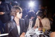 <p>The Rolling Stones take over the Trax discotheque in London. The band was launching a new album,<em> Love You Live, </em>by signing autographs for fans. </p>