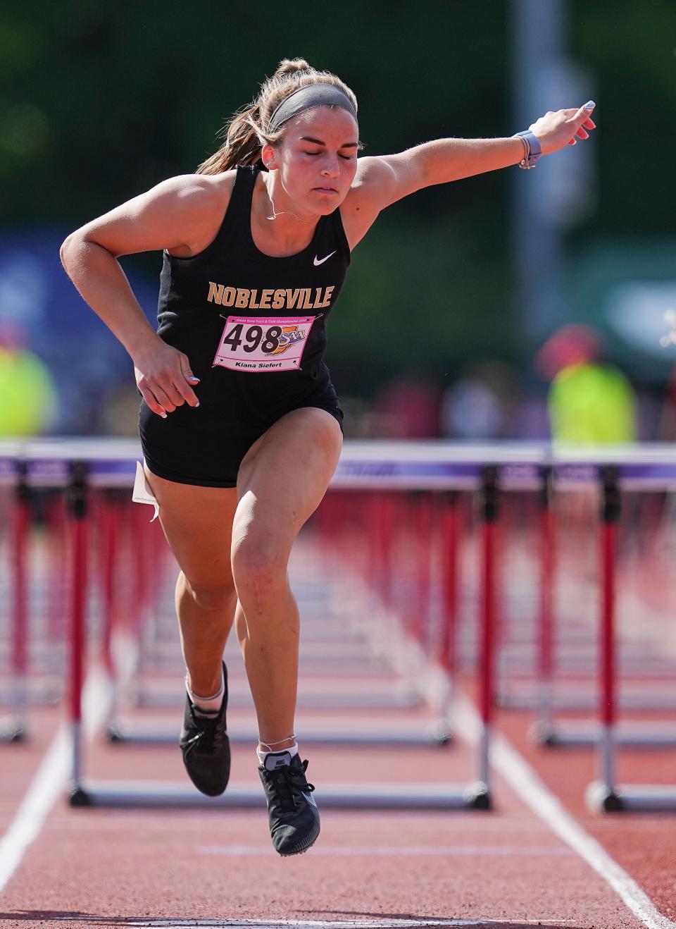 Noblesville Kiana Siefert crosses the finish line during the second heat of the 100 meter hurdles during the IHSAA girls track and field state finals on Friday, June 3, 2022, at Robert C. Haugh Track & Field Complex, at Indiana University in Bloomington, Indiana.