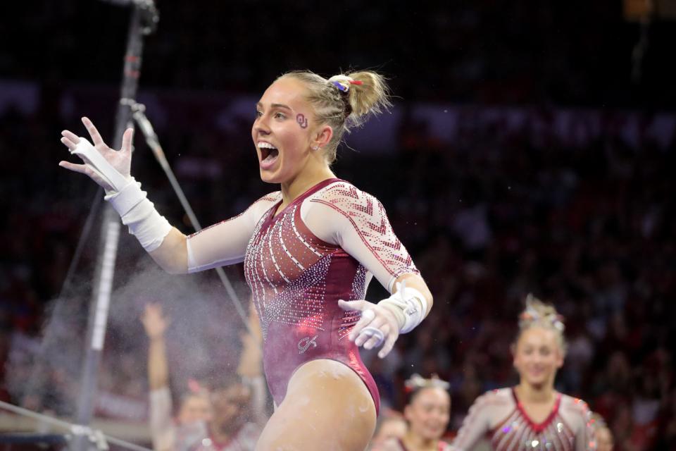 Oklahoma's Olivia Trautman celebrates after competing on the bars during a women's college gymnastics meet between the University of Oklahoma Sooners (OU) and Florida at Lloyd Noble in Norman, Okla., Friday, March 3, 2023. 