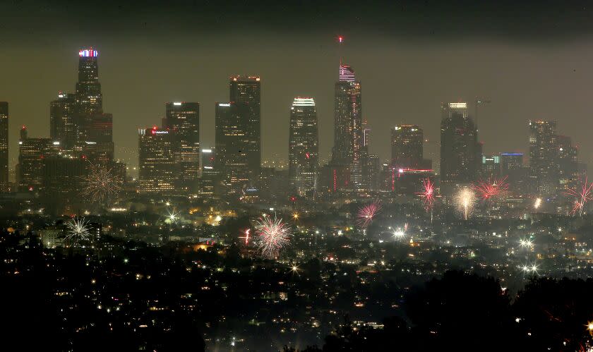 LOS ANGELES, CALIF. - JULY 4, 2022. Illegal fireworks explode over downtown Los Angeles on the Fourth of July. (Luis Sinco / os Angeles Times)