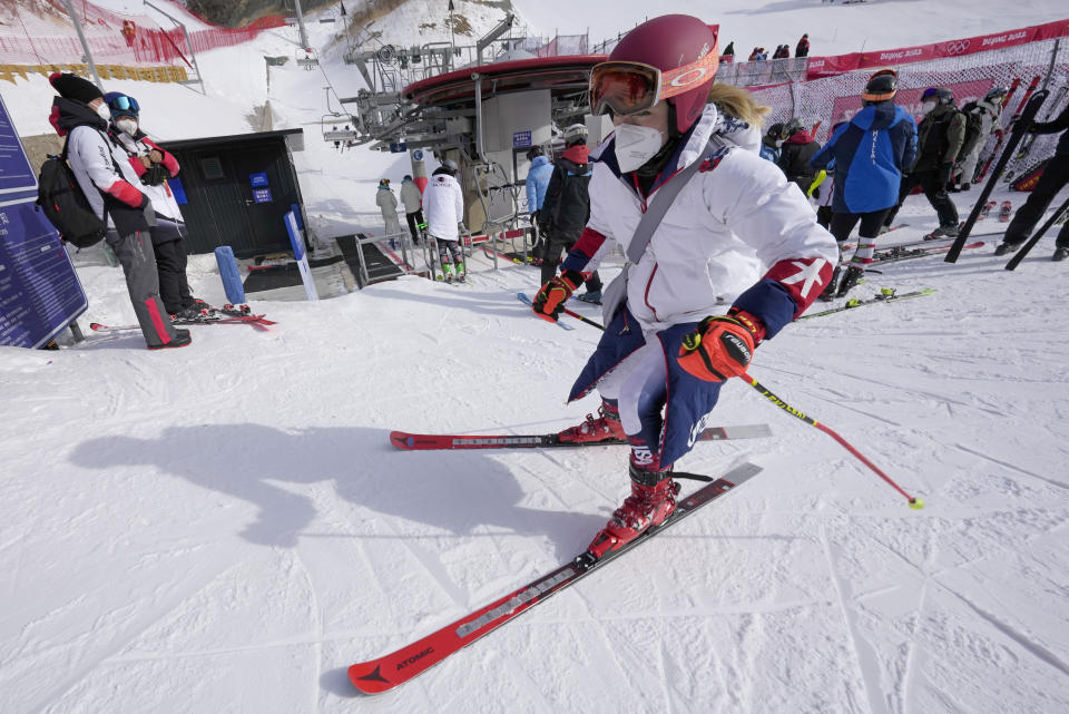 Mikaela Shiffrin of United States leaves the finish area after skiing off course during the first run of the women's giant slalom at the 2022 Winter Olympics, Monday, Feb. 7, 2022, in the Yanqing district of Beijing. (AP Photo/Luca Bruno)