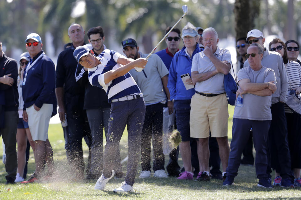 Xinjun Zhang, of China, hits from the rough on the ninth hole during the second round of the Honda Classic golf tournament, Friday, Feb. 28, 2020, in Palm Beach Gardens, Fla. (AP Photo/Lynne Sladky)