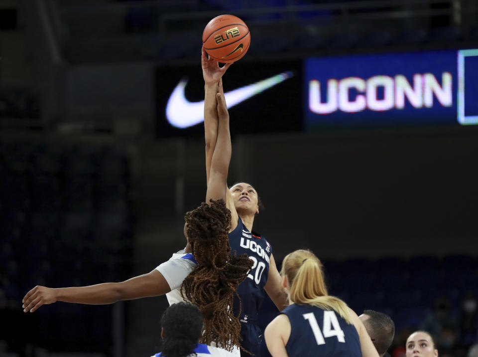 Connecticut forward Olivia Nelson-Ododa (20) jumps up for the opening tip against DePaul in the first half of an NCAA college basketball game at Wintrust Arena in Chicago on Wednesday, Jan. 26, 2022. (Chris Sweda/Chicago Tribune via AP)