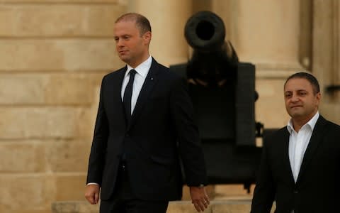 The journalist's sons called for the resignation of Joseph Muscat (L), Malta's prime minister - Credit: Reuters