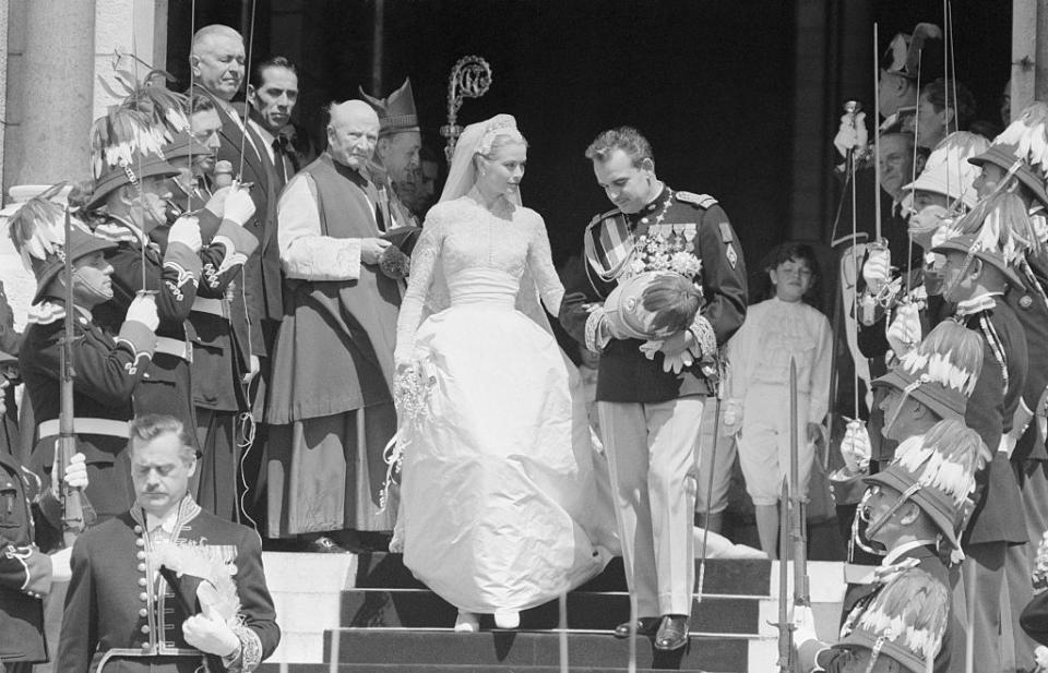 <p>Grace Kelly and Prince Rainier of Monaco met at the 1955 Cannes Film Festival. On April 19, 1956, the Philadelphia-born actress, in <a href="https://www.goodhousekeeping.com/beauty/fashion/g4719/grace-kelly-wedding-gown/" rel="nofollow noopener" target="_blank" data-ylk="slk:a dress designed by Helen Rose;elm:context_link;itc:0;sec:content-canvas" class="link ">a dress designed by Helen Rose</a>, married the prince at the Cathedral of Saint Nicholas. They had three children and remained married until she died in 1982.</p>