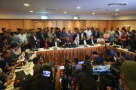 In this Feb. 22, 2020, photo, Malaysian Prime Minister Mahathir Mohamad, center right, speaks during a press conference in Putrajaya, Malaysia. Malaysia's alliance government under 94-year-old Prime Minister Mahathir is threatening to unravel less than two years after a historic election victory ousting the coalition that had ruled the country since independence.(AP Photo/Vincent Thian)