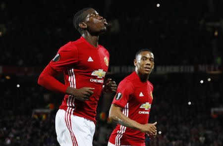 Britain Football Soccer - Manchester United v Fenerbahce SK - UEFA Europa League Group Stage - Group A - Old Trafford, Manchester, England - 20/10/16 Manchester United's Paul Pogba celebrates scoring their first goal from the penalty spot with Anthony Martial Action Images via Reuters / Jason Cairnduff Livepic