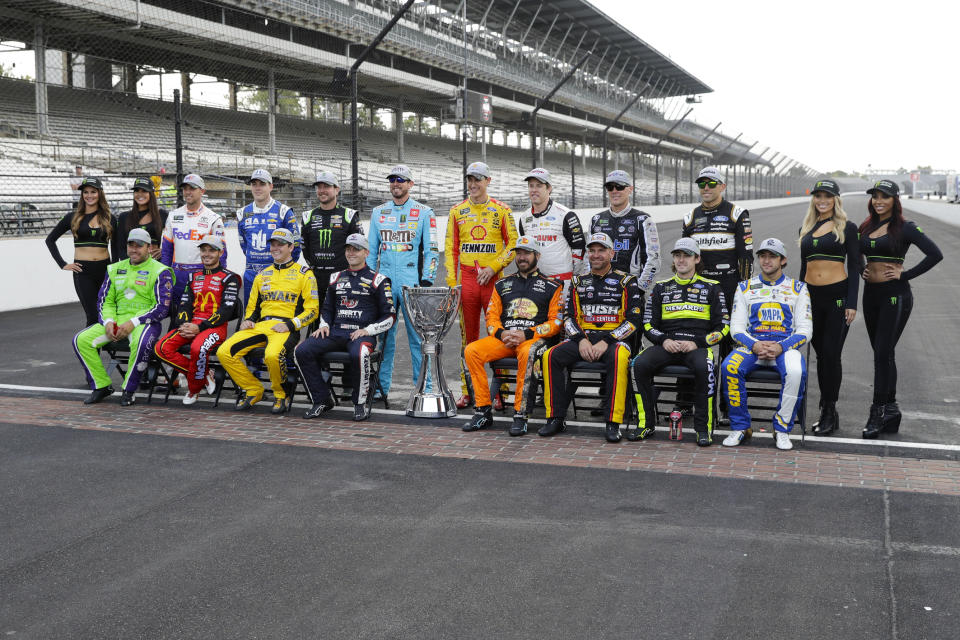 Drivers who qualified the NASCAR Cup Series playoff pose on the the start/finish line following the Brickyard 400 auto race at Indianapolis Motor Speedway, Sunday, Sept. 8, 2019, in Indianapolis. (AP Photo/Darron Cummings)