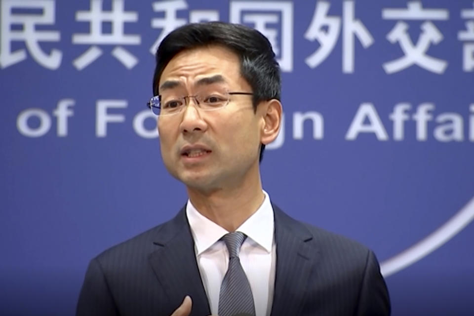FILE - In this Wednesday, July 17, 2019 file image from video, Chinese Foreign Ministry spokesman Geng Shuang speaks during a media briefing. China is calling on Washington to “correct” sanctions imposed on Chinese companies accused of helping Iran acquire materials for its nuclear program. The foreign ministry spokesman on Friday, July 19, said U.S. pressure on Iran and its “long-arm jurisdiction” against companies in third countries is the “root cause” of tension with Tehran.(AP Photo/File)