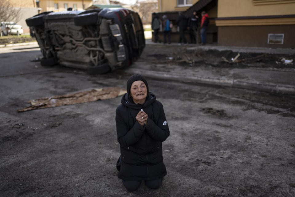 Tanya Nedashkivs'ka, 57, mourns the death of her husband, killed in Bucha, on the outskirts of Kyiv, Ukraine, Monday, April 4, 2022. Russia is facing a fresh wave of condemnation after evidence emerged of what appeared to be deliberate killings of civilians in Ukraine. (AP Photo/Rodrigo Abd)