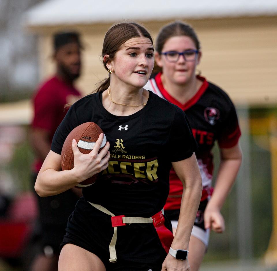 Holland Hertog, a player for the girls flag football team at Riverdale High School runs the ball during a practice on Monday, Feb. 12, 2024.