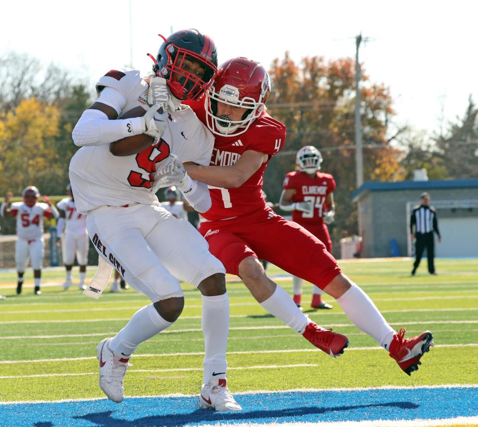 Del City's Ladainian Fields catches a touchdown pass in front of Walker Dunaway at a semi-final playoff game as Del City plays Claremore on Nov 24, 2023; in Noble, Oklahoma, USA; at Noble High School. Mandatory Credit: Steve Sisney-The Oklahoman