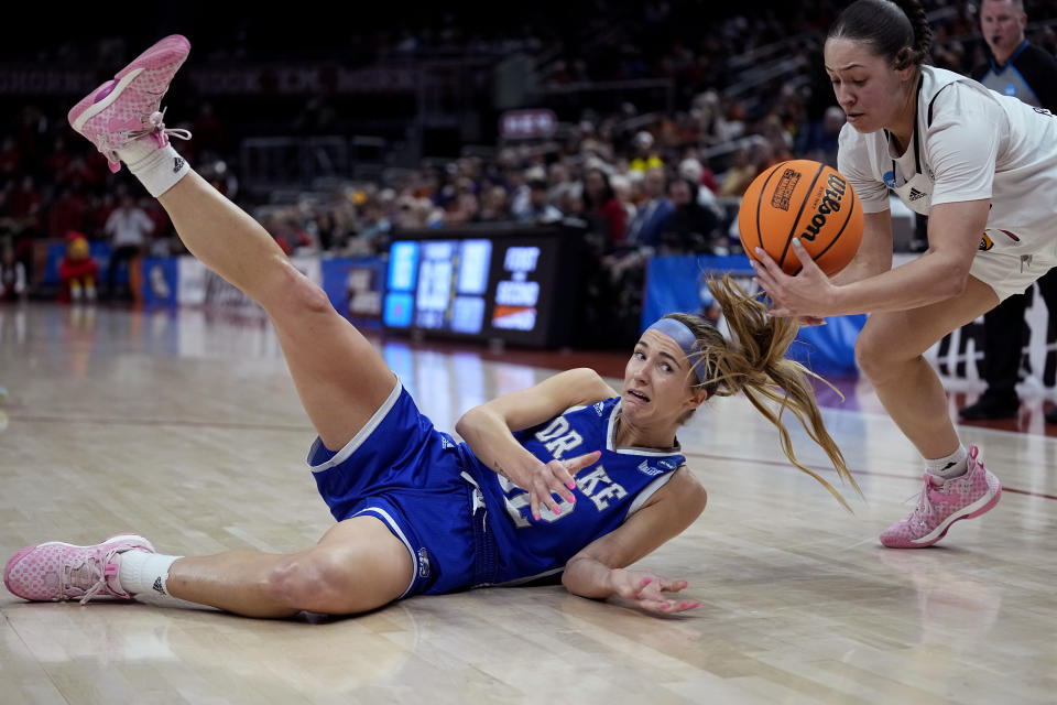 Drake forward Courtney Becker (32) loses the ball to Louisville guard Mykasa Robinson (5) during the second half of a first-round college basketball game in the NCAA Tournament in Austin, Texas, Saturday, March 18, 2023. (AP Photo/Eric Gay)