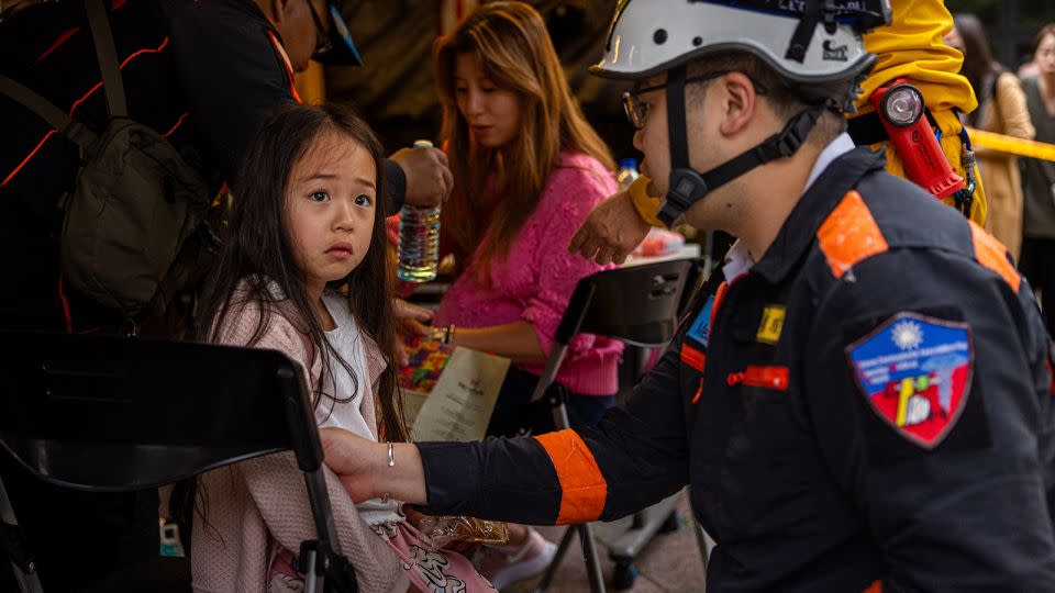 A child is given medical care at a makeshift rescue command post outside Taroko Gorge after being rescued on April 5, 2024. - Annabelle Chih/Getty Images