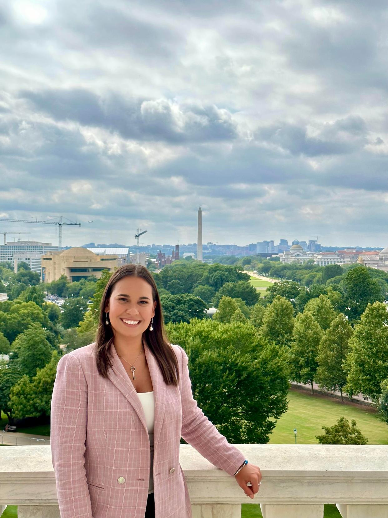 Athina Lawson on a capitol building balcony in Washington D.C.