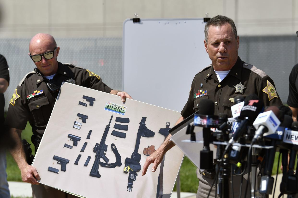 Vanderburgh County Sheriff Dave Wedding shows a photograph of the weapons that were found in the possession of fugitives Casey White and Vicky White following their capture.