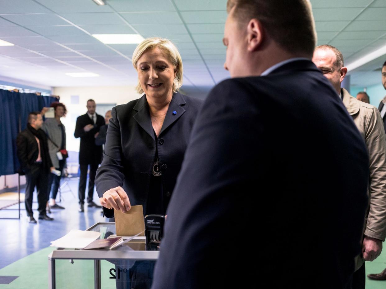 As voting drew to a close in round one of a bitterly contested presidential race, polling suggested Le Pen and centrist Emmanual Macron were in the lead: Getty