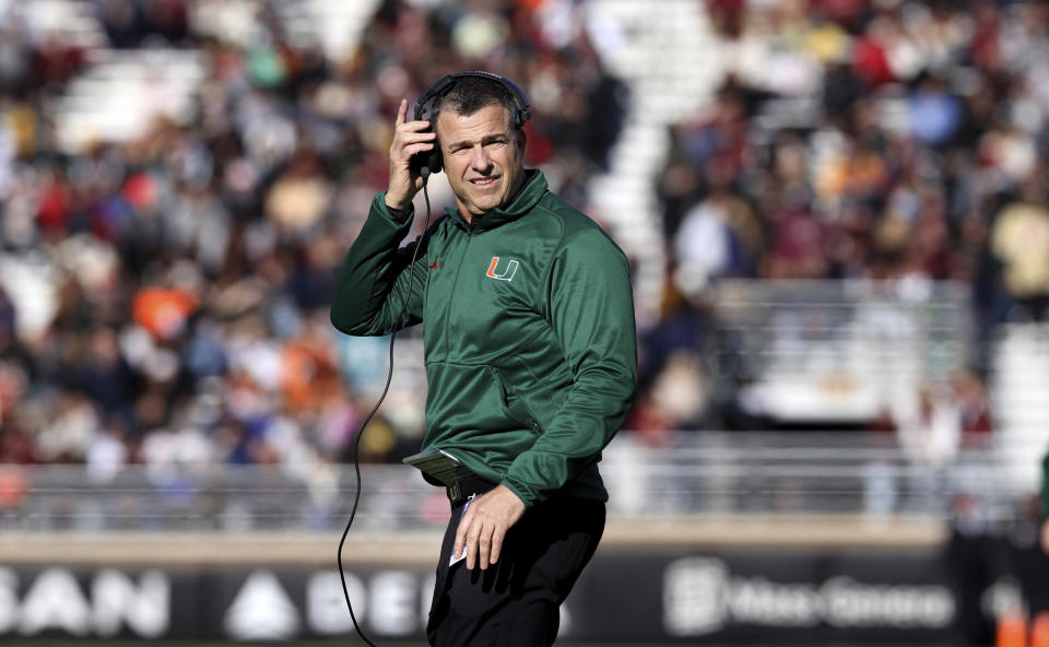 FILE - Miami football head coach Mario Cristobal looks on during an NCAA college football game against Boston College, Nov. 24, 2023, in Boston. Cristobal and Rutgers coach Greg Schiano have worked together at both schools that'll play in the Pinstripe Bowl at Yankee Stadium on Thursday, Dec. 28. (AP Photo/Mark Stockwell, File)