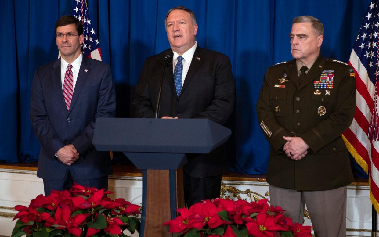 Secretary of Defense Mark Esper, left, and Chairman of the Joint Chiefs of Staff Gen. Mark Milley, right, listen as Secretary of State Mike Pompeo delivers a statement on Iraq and Syria - AP