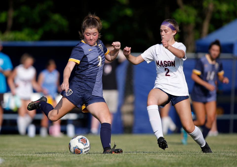 DeWitt's Rachel Savage, left, and Mason's Reegyn Cady vie for the ball, Thursday, June 1, 2023, in DeWitt.