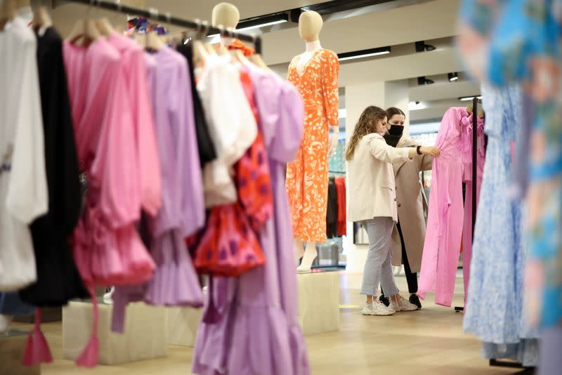 FILE PHOTO: People shop in the Selfridges department store on Oxford street, as the coronavirus disease (COVID-19) restrictions ease, in London