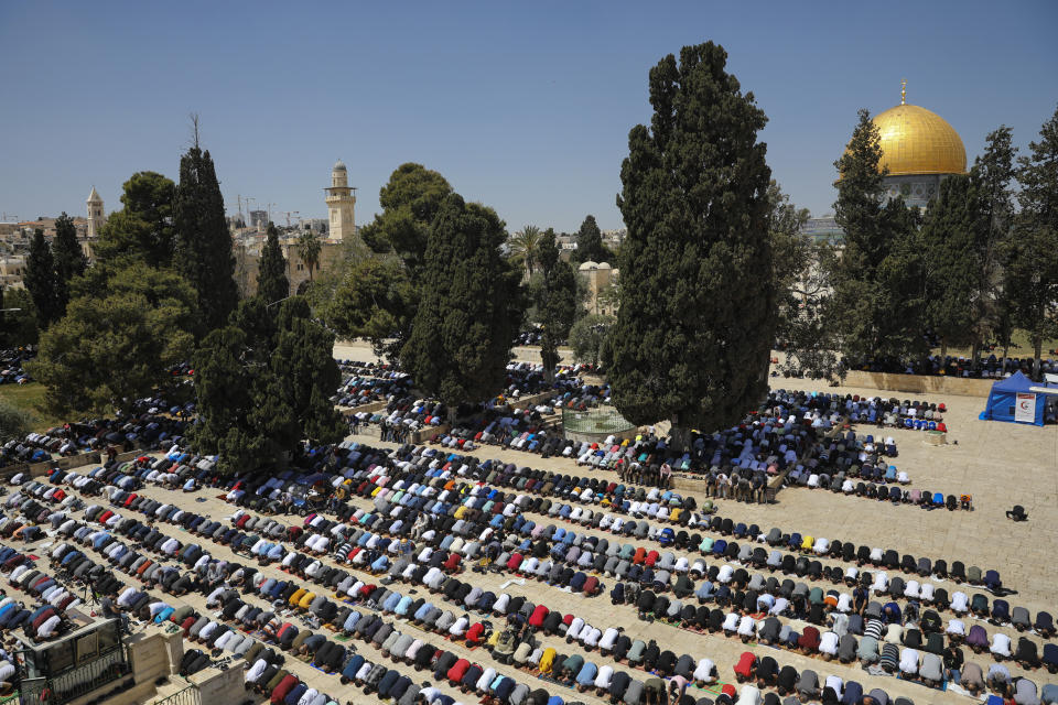 Palestinian worshipers pray during the first Friday of the holy month of Ramadan at the Al Aqsa Mosque compound in Jerusalem's old city, Friday, April. 16, 2021. (AP Photo/Mahmoud Illean)