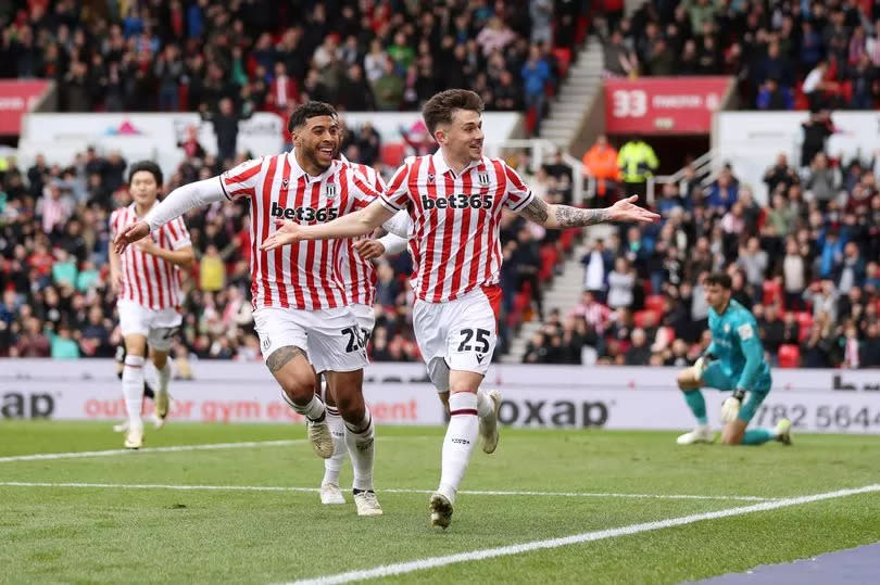 Luke Cundle celebrates with team-mate Josh Laurent during the Sky Bet Championship match between Stoke City and Bristol City at the bet365 Stadium.